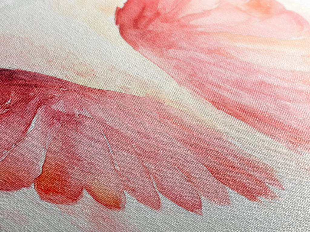 Close-up of pink watercolor angel wing canvas art with textured brush strokes