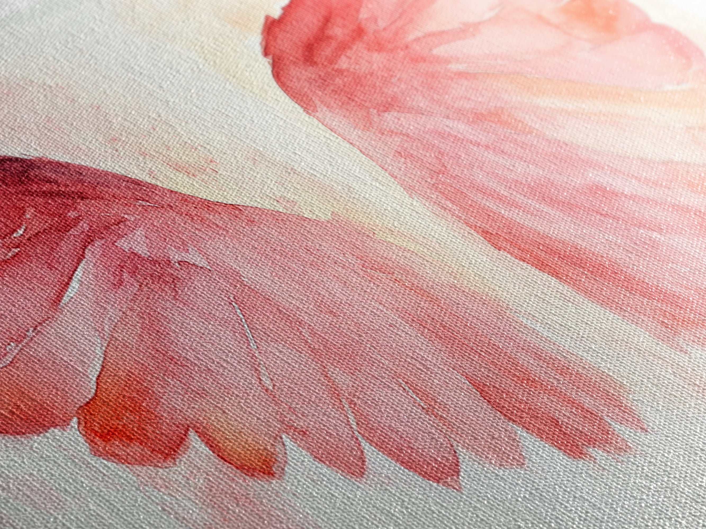 Close-up of pink watercolor angel wing canvas art with textured brush strokes