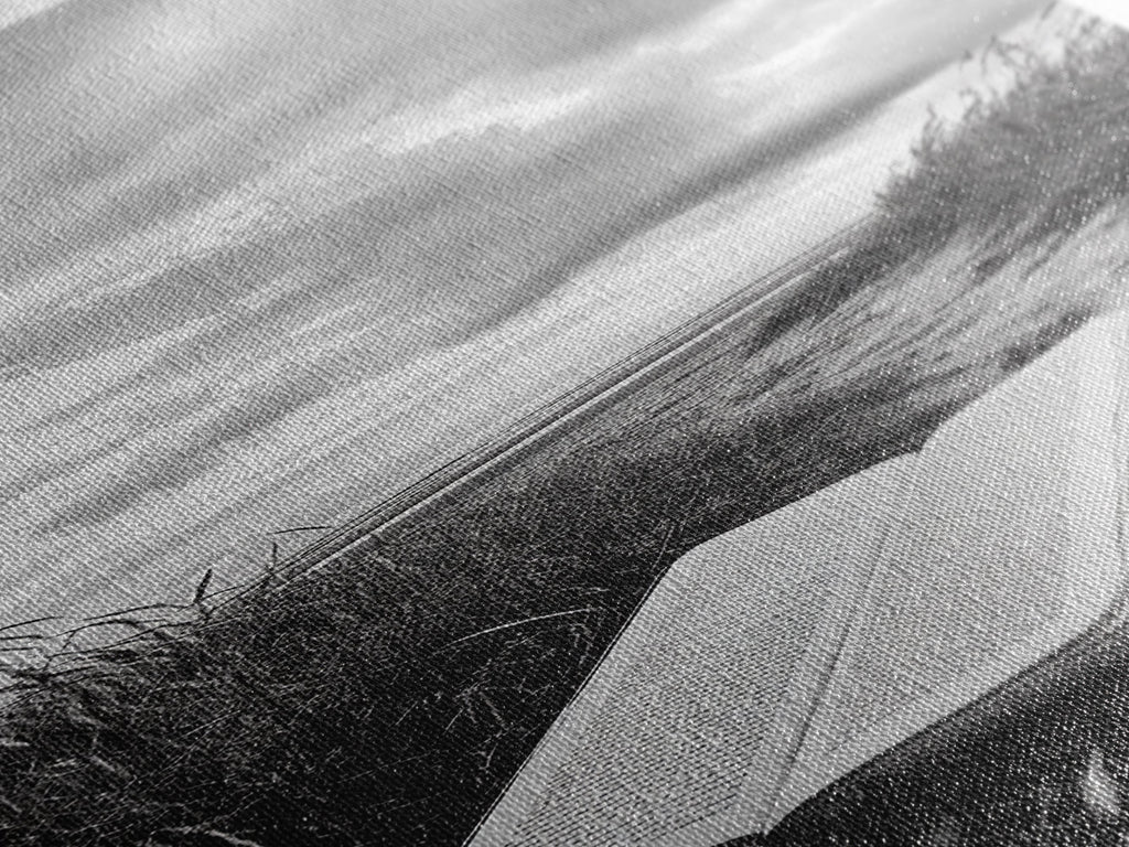 Close-up of canvas print texture featuring an open Bible on a beach path