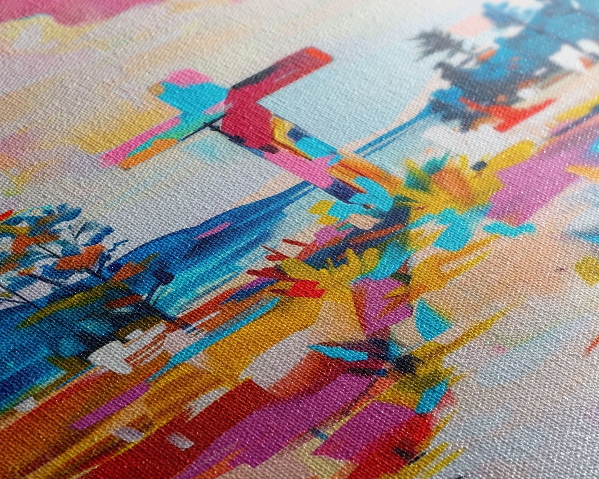Close-up of colorful canvas artwork showing cross silhouette and abstract landscape