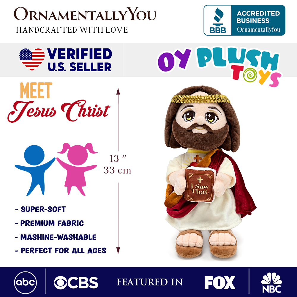 Plush Jesus stuffed doll in white robe and red cape, holding “I Saw That” book.