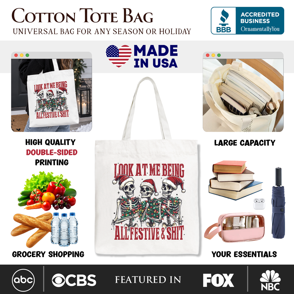 White cotton tote bag showing front skeleton holiday print with red text; white handles