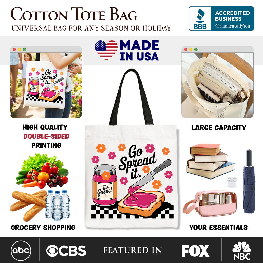 White cotton tote bag with black handles and central colorful 'Go Spread It' artwork