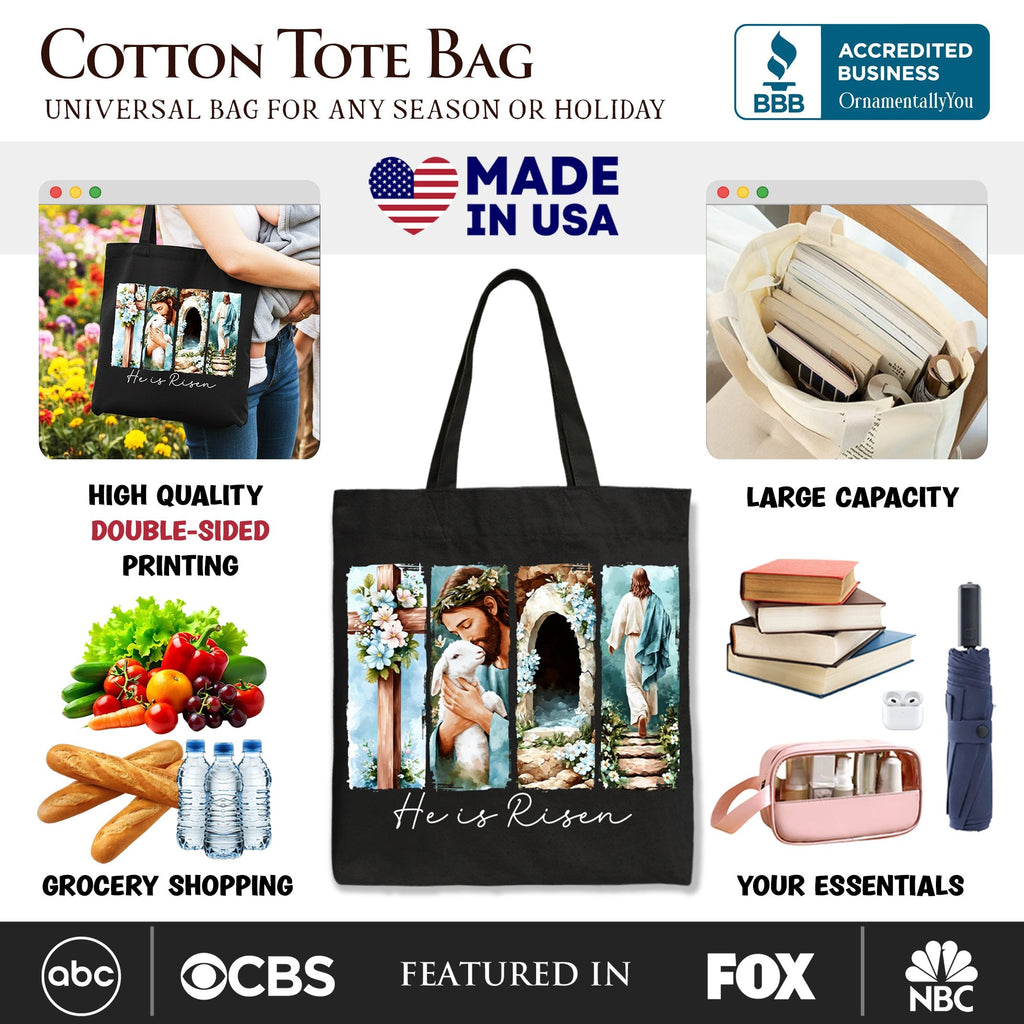 Black cotton tote bag with "He Is Risen" floral collage graphic on front panel.