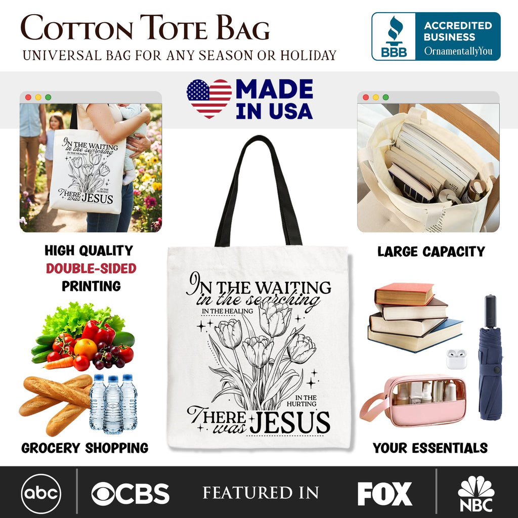 Cotton tote bag with black handles and double-sided floral scripture print, front view