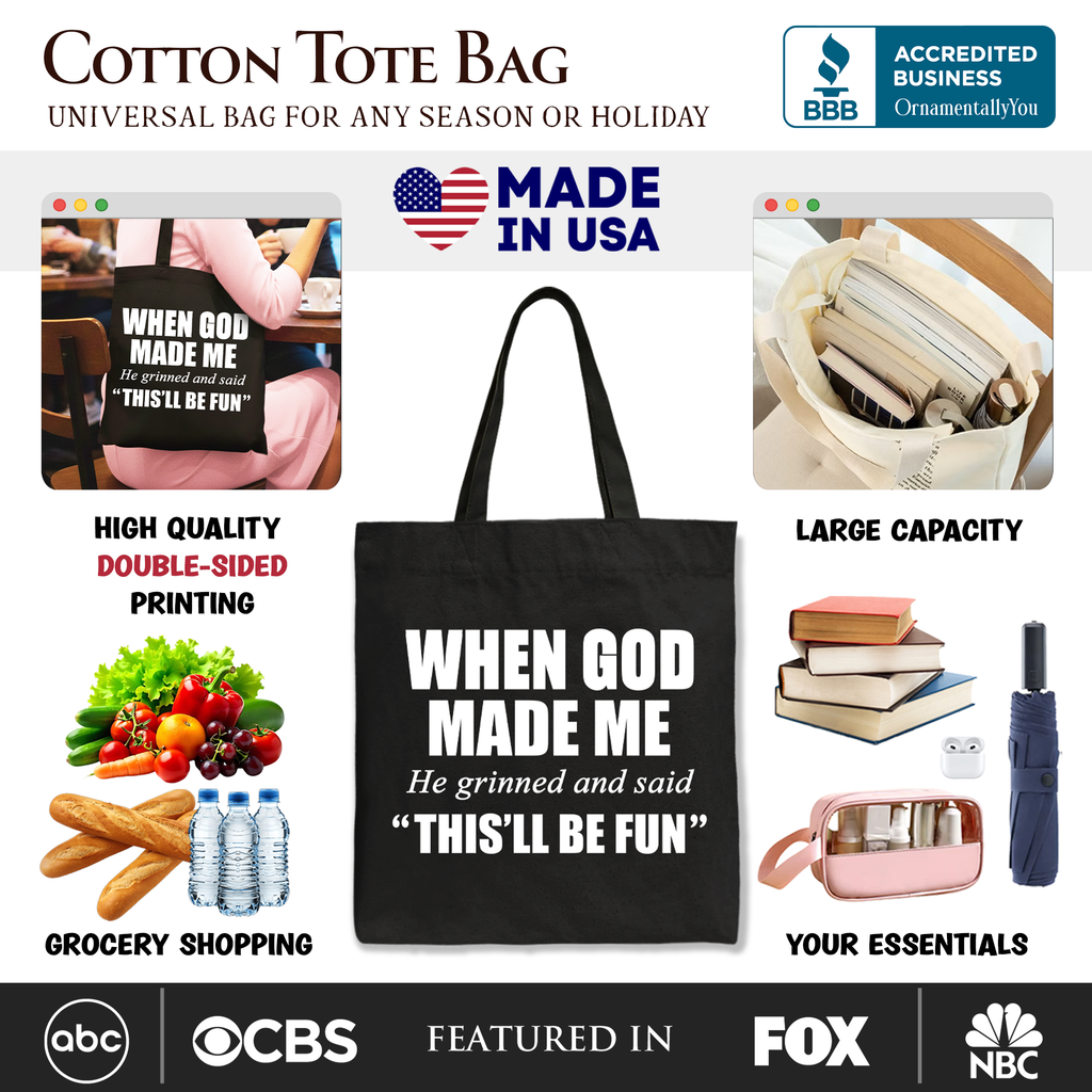 Black tote bag with long handles, “WHEN GOD MADE ME” and “THIS’LL BE FUN” text.