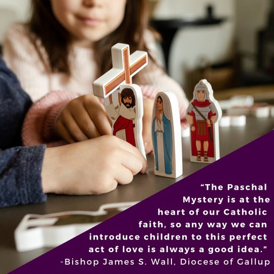 Child arranging character cutouts from the Stations of the Cross pray & play set with text card