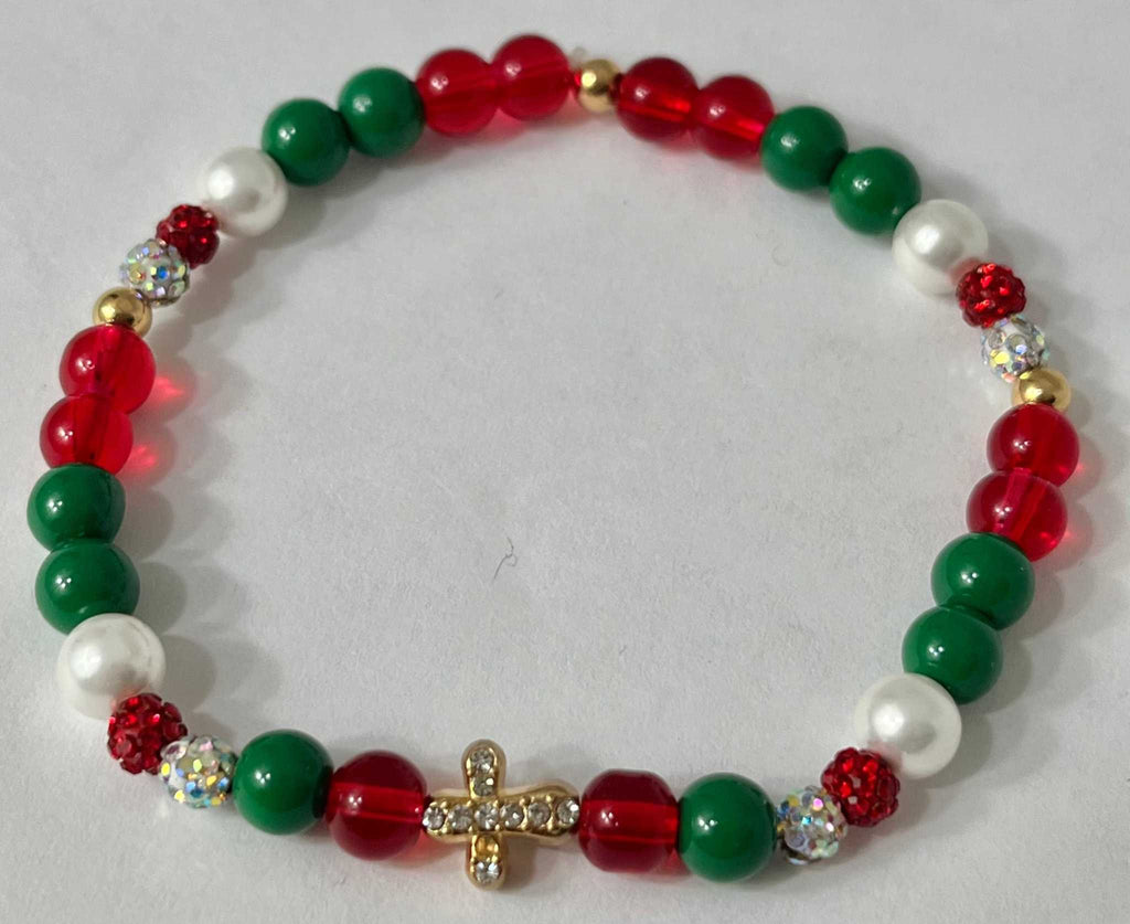 Bead bracelet with red, green, and white beads and a gold jeweled cross center charm