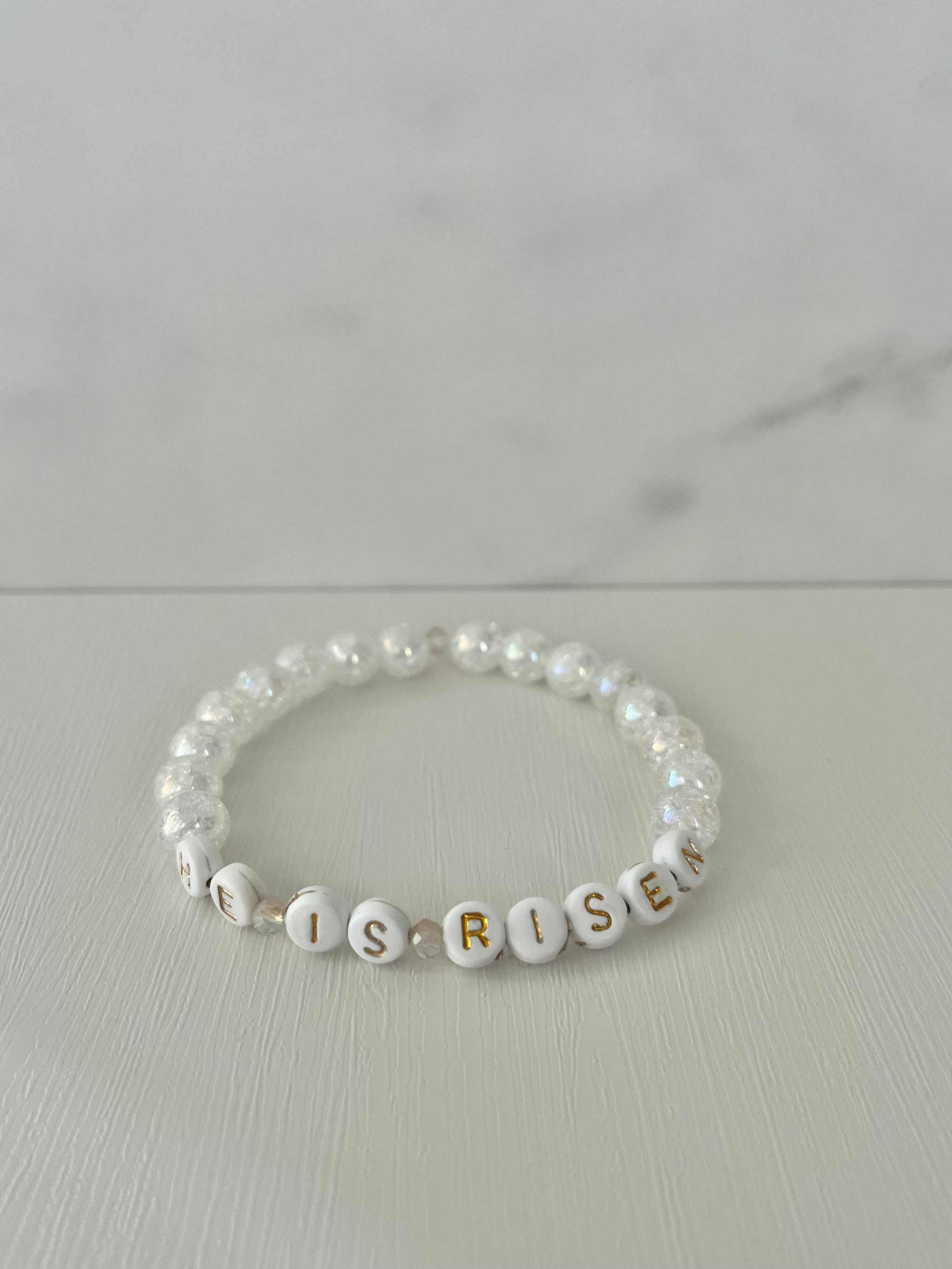 White pearl bead bracelet with “HE IS RISEN” letter beads
