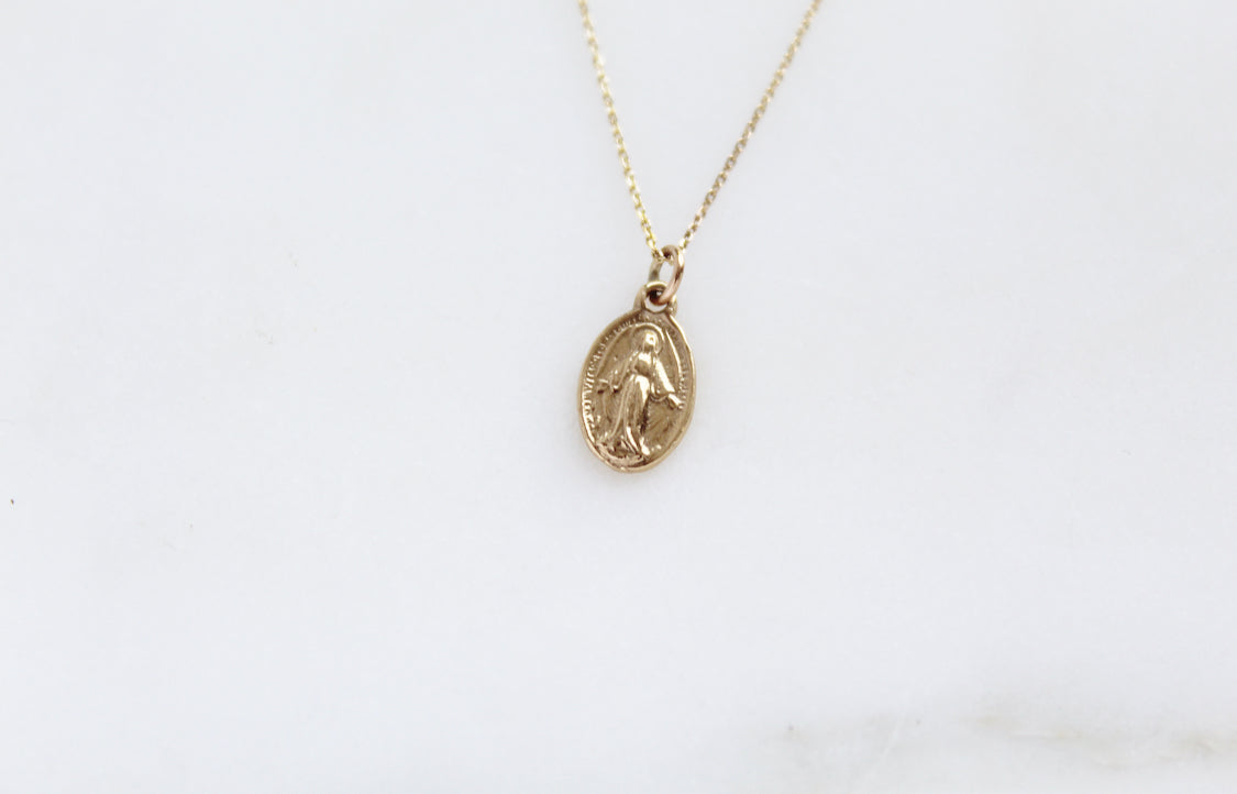 14k gold Miraculous medal necklace with oval pendant on thin chain