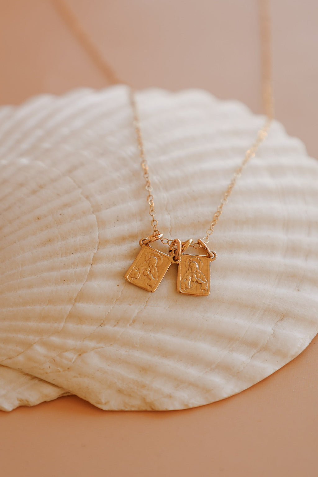 Scapular charm necklace with two rectangular pendant charms on a gold chain