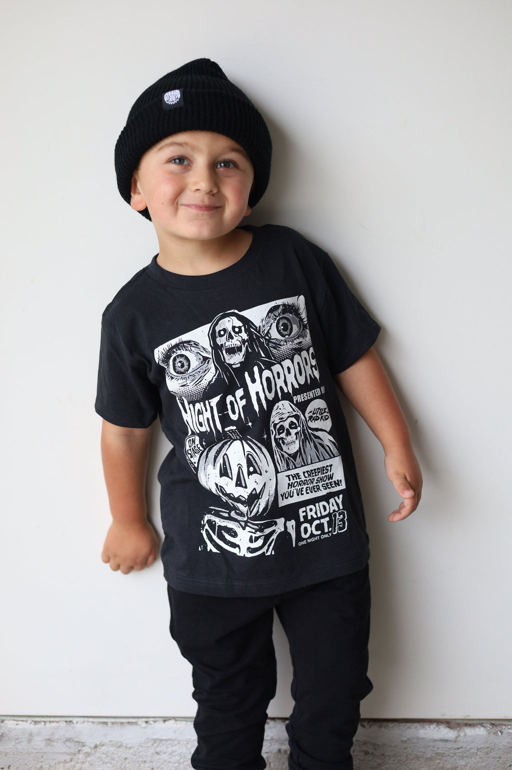Black kids graphic T-shirt with horror poster-style illustration and “Friday Oct. 13”