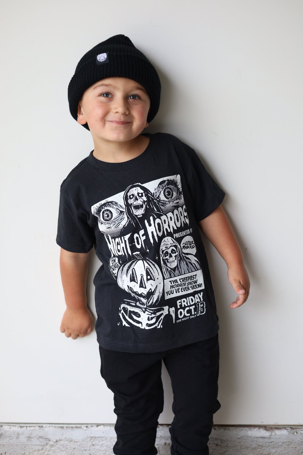 Black kids graphic T-shirt with horror poster-style illustration and “Friday Oct. 13”