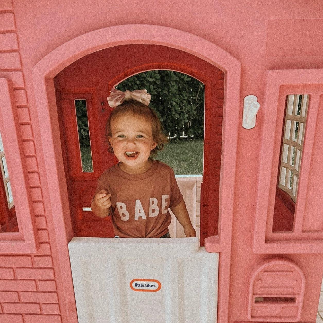 Dusty rose baby T-shirt with white "BABE" lettering