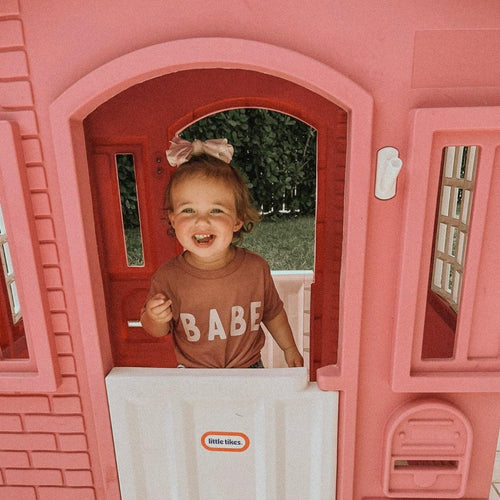 Dusty rose baby T-shirt with white "BABE" lettering