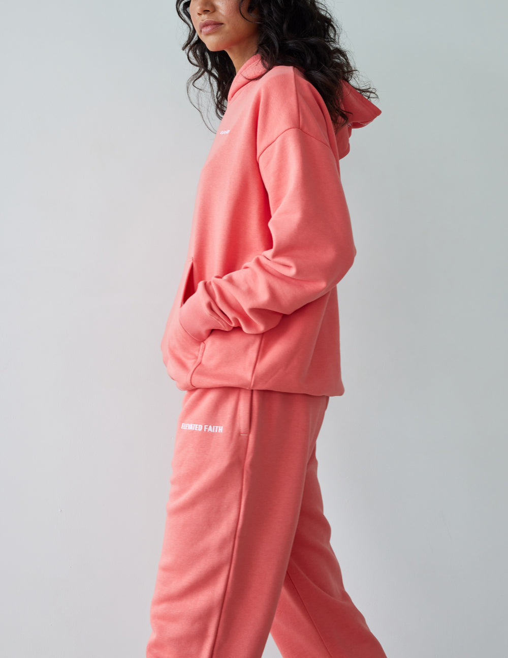 Unisex coral pink sweatpants, relaxed straight leg with elastic hem cuffs