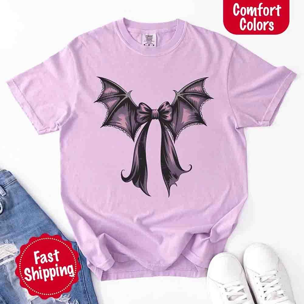 Lavender bat bow Halloween T-shirt with black bat wings graphic on front
