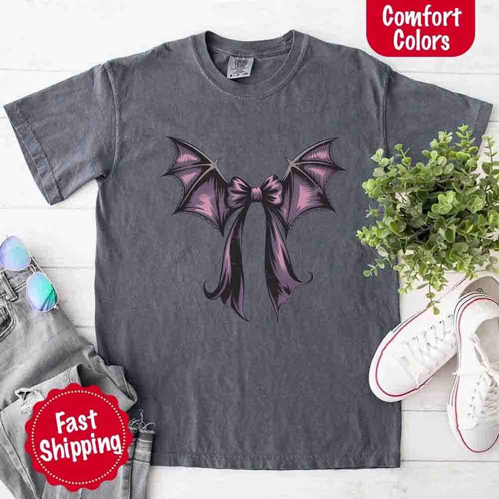 Dark gray Halloween T-shirt with black and purple bat bow graphic at center chest