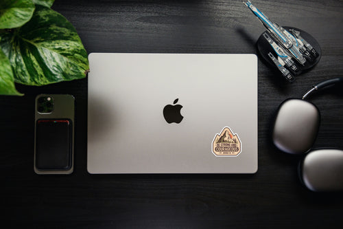 Laptop with small Christian Bible verse sticker reading Joshua 1:9.