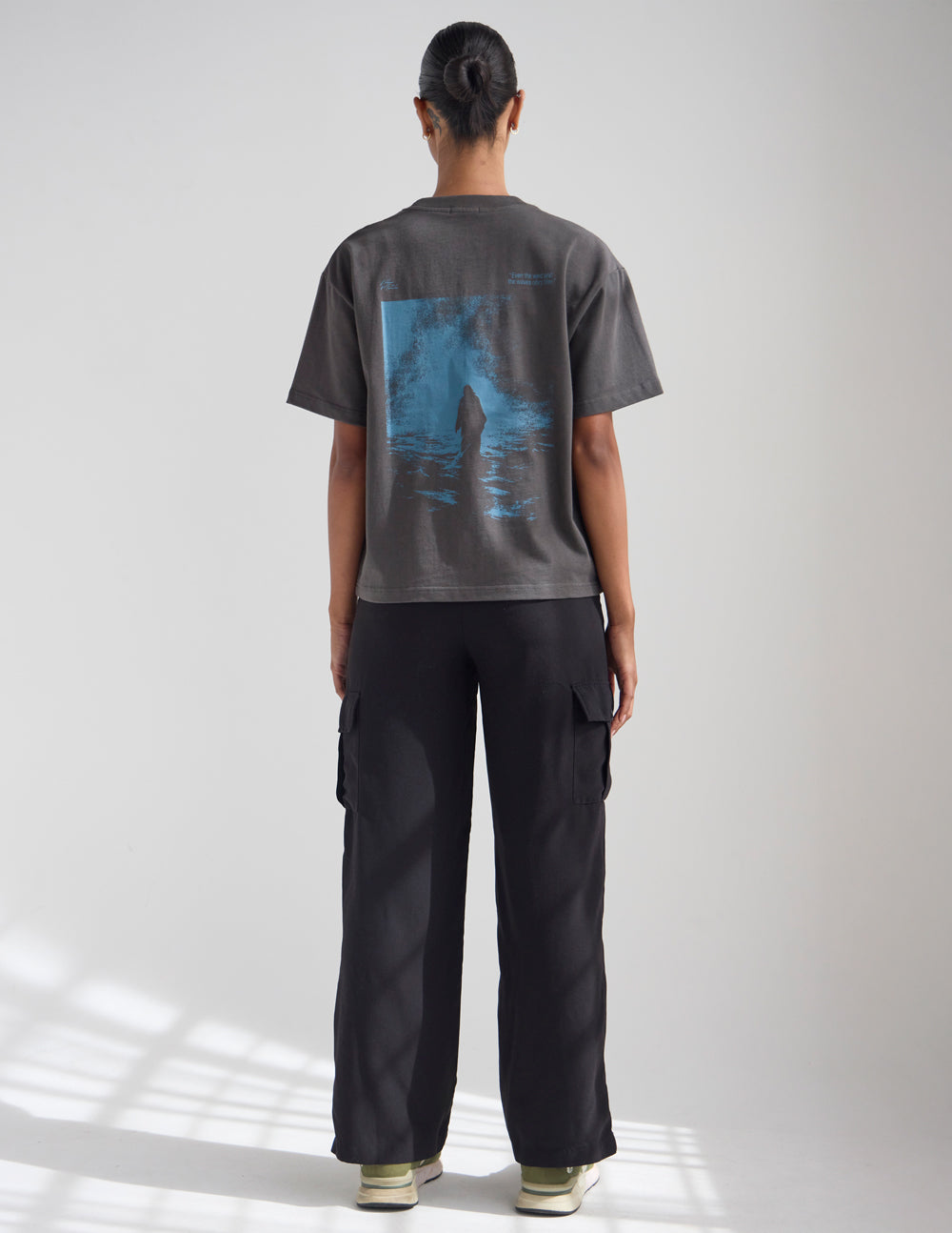 Dark gray crew-neck T-shirt with blue graphic on the back