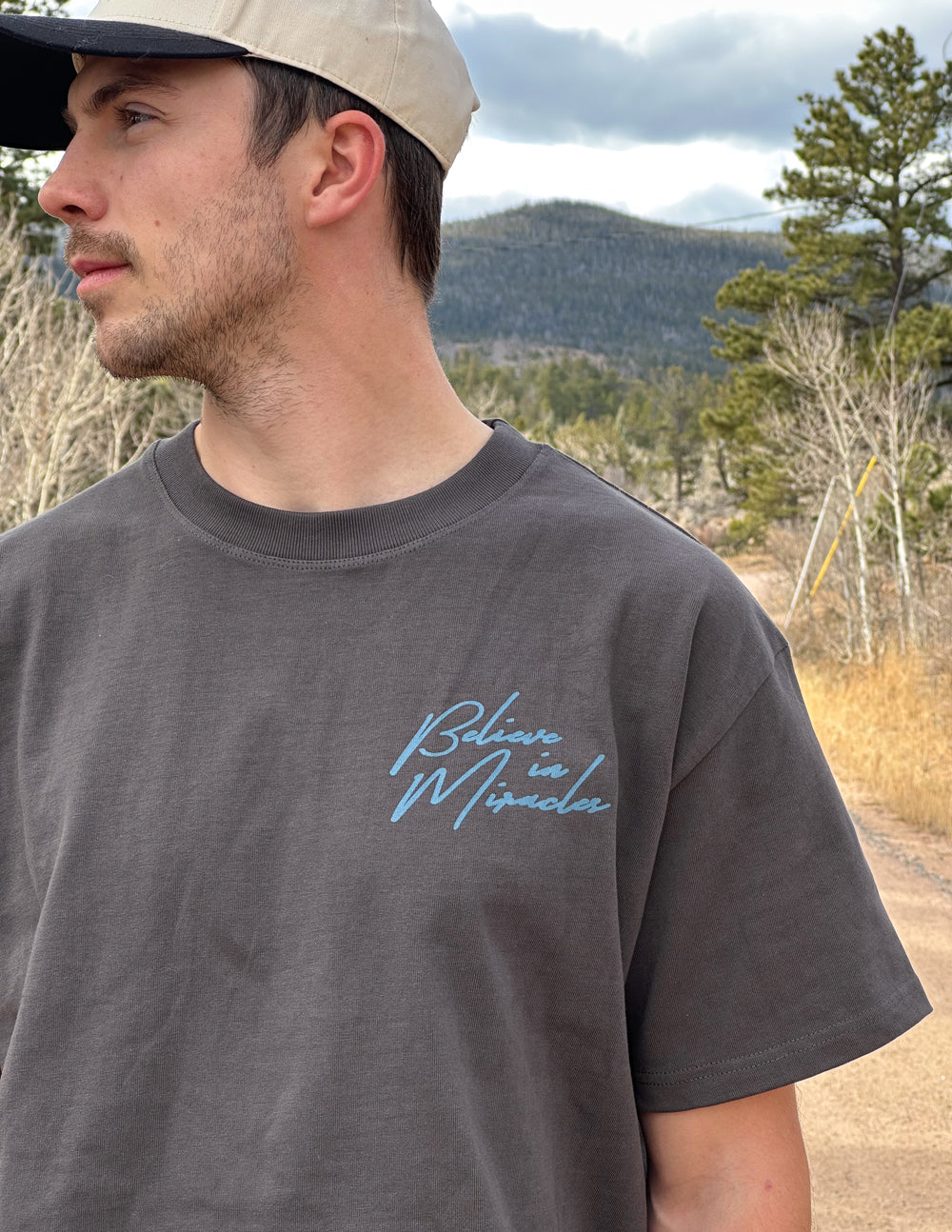 Dark gray crew-neck T-shirt with cursive front logo