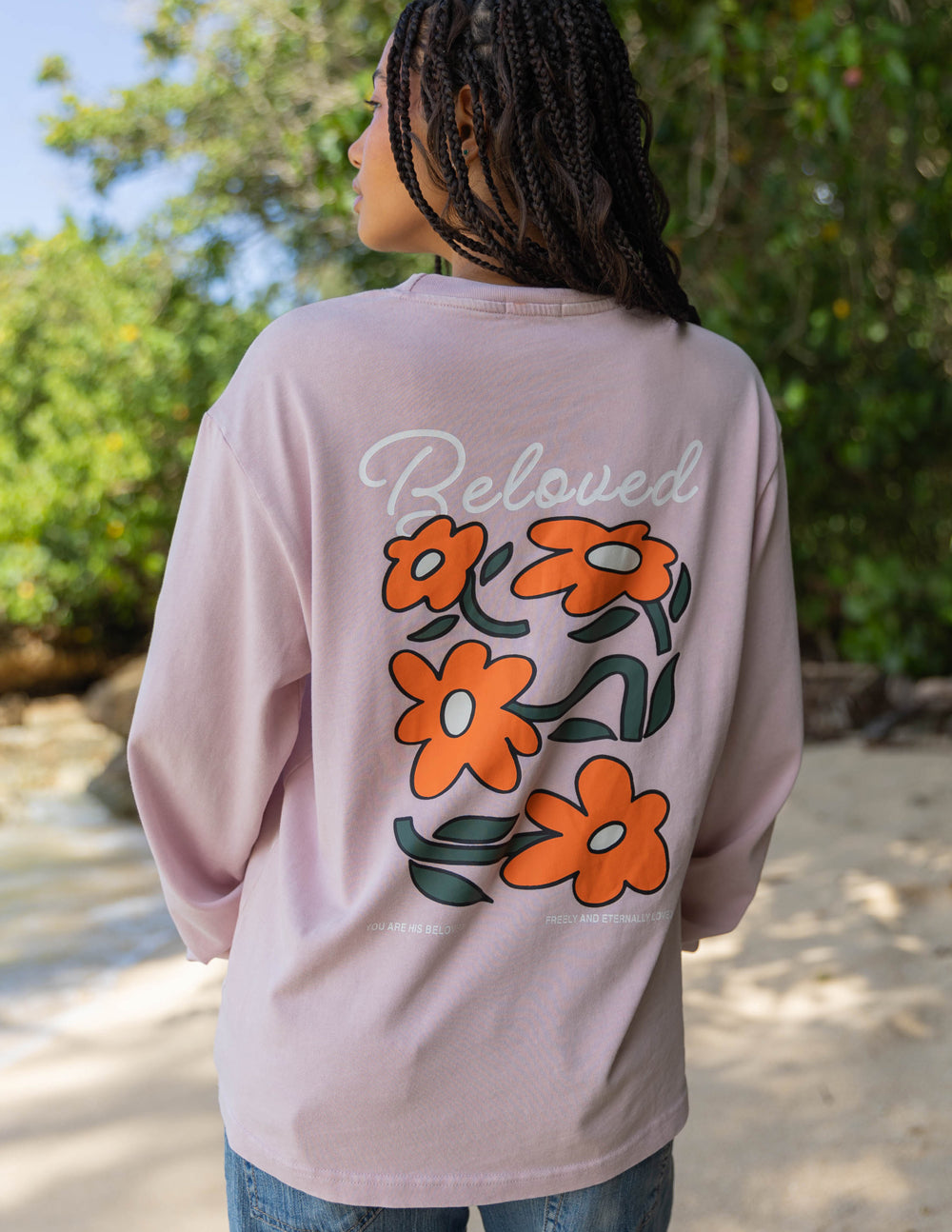 Light purple long-sleeve unisex tee with 'Beloved' and orange flower graphic on back