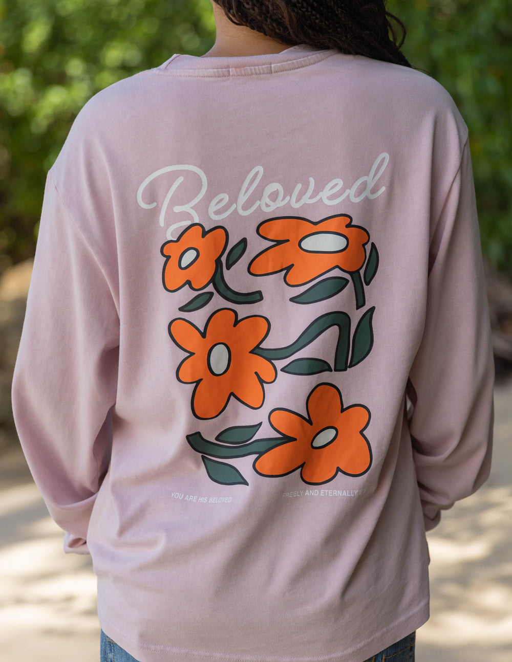 Light purple long-sleeve unisex tee with 'Beloved' script and orange flower graphic