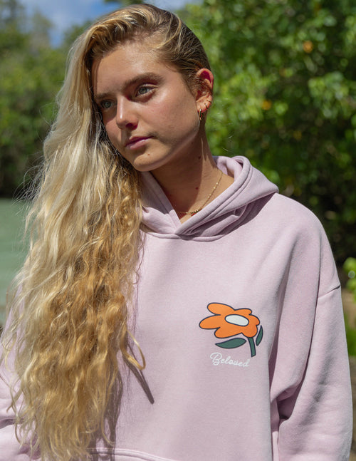 Lilac unisex hoodie with small floral logo on chest and 'Beloved' script