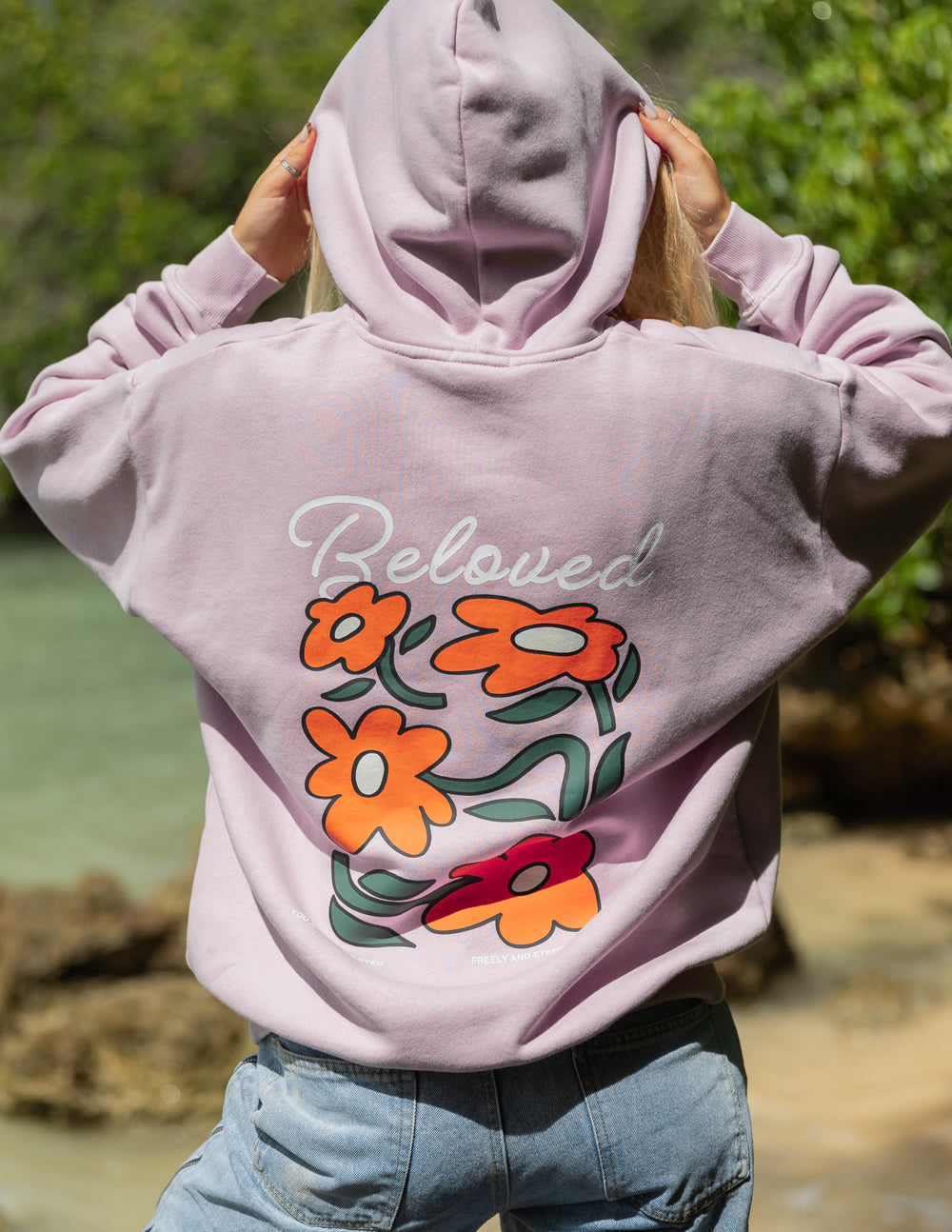 Lilac unisex hoodie with large front floral graphic and 'Beloved' script