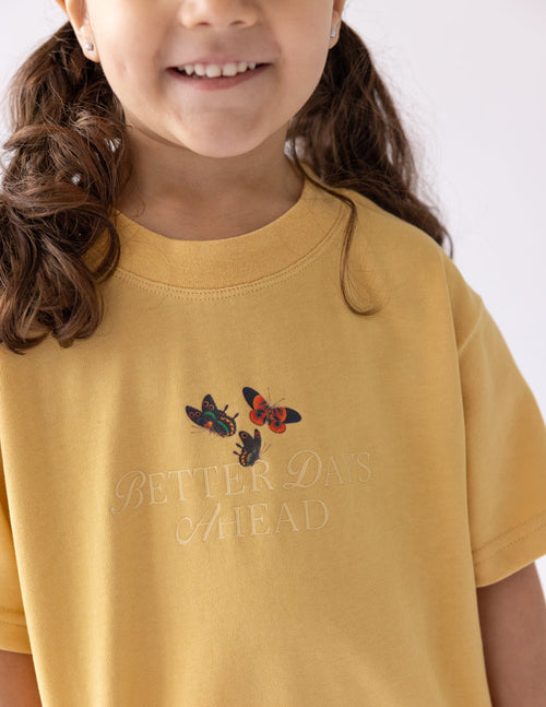 Kids graphic T-shirt in mustard yellow with butterfly print on chest