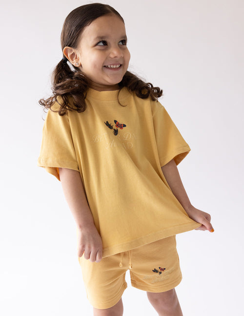 Kids butterfly graphic T-shirt and matching shorts, mustard yellow