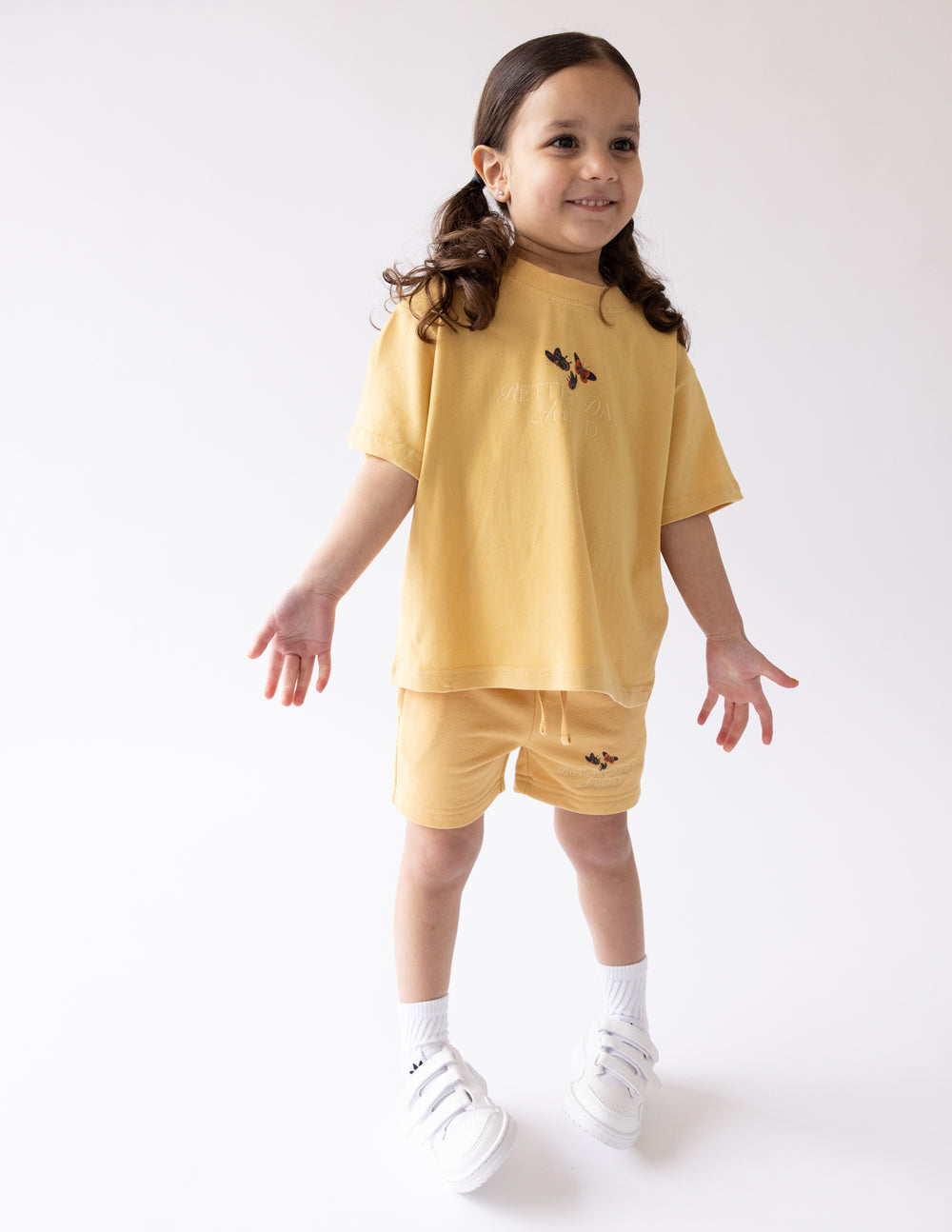 Kids butterfly graphic T-shirt in mustard yellow, short sleeves