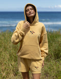 Unisex tan hoodie with butterfly graphic, front pocket and drawstring hood