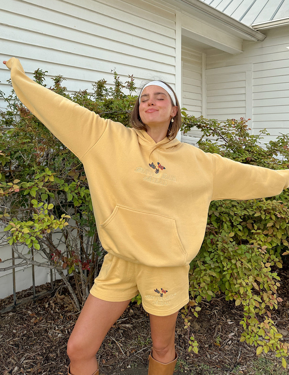 Unisex tan hoodie with butterfly graphic, hooded sweatshirt style and shorts