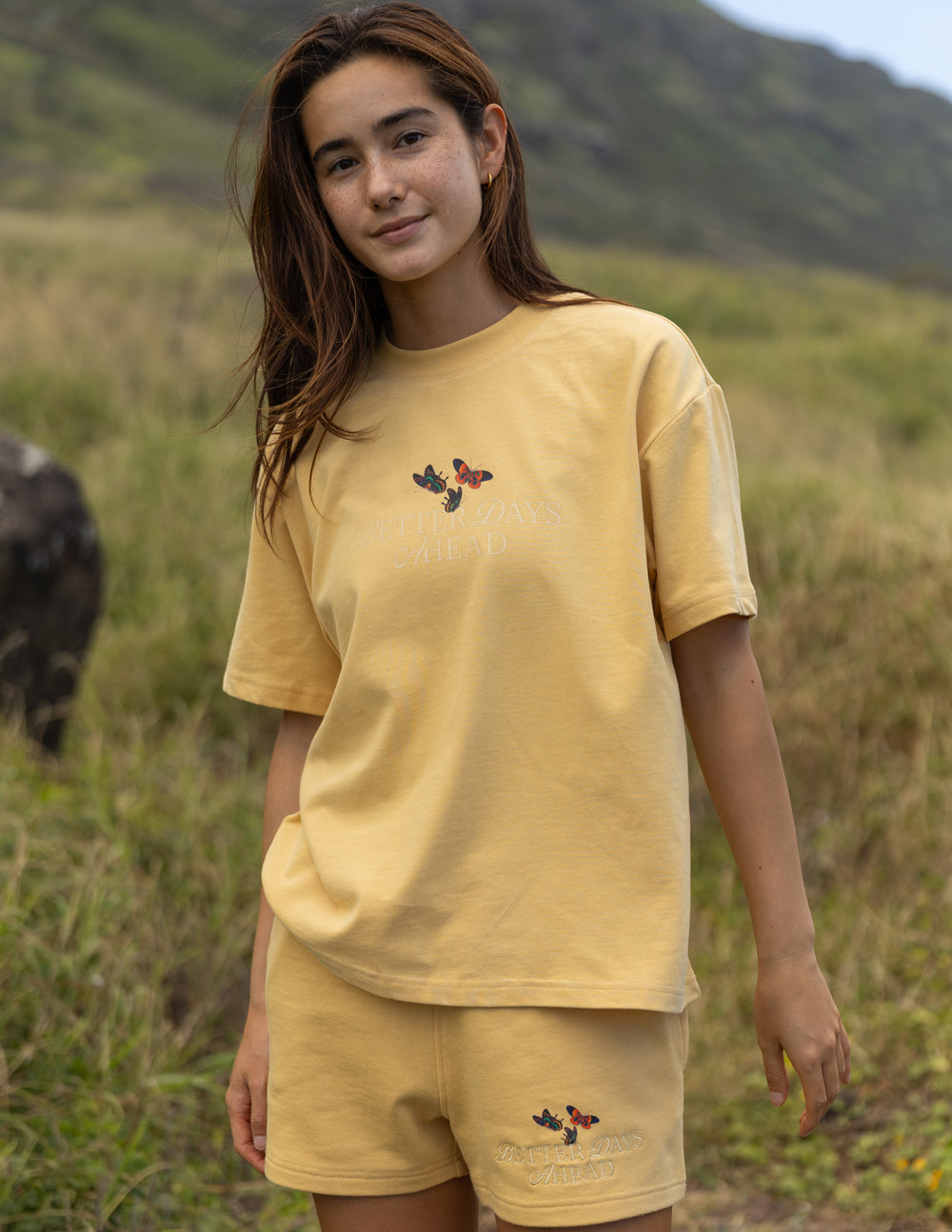Yellow unisex T-shirt with butterfly graphic at center chest, crew neck