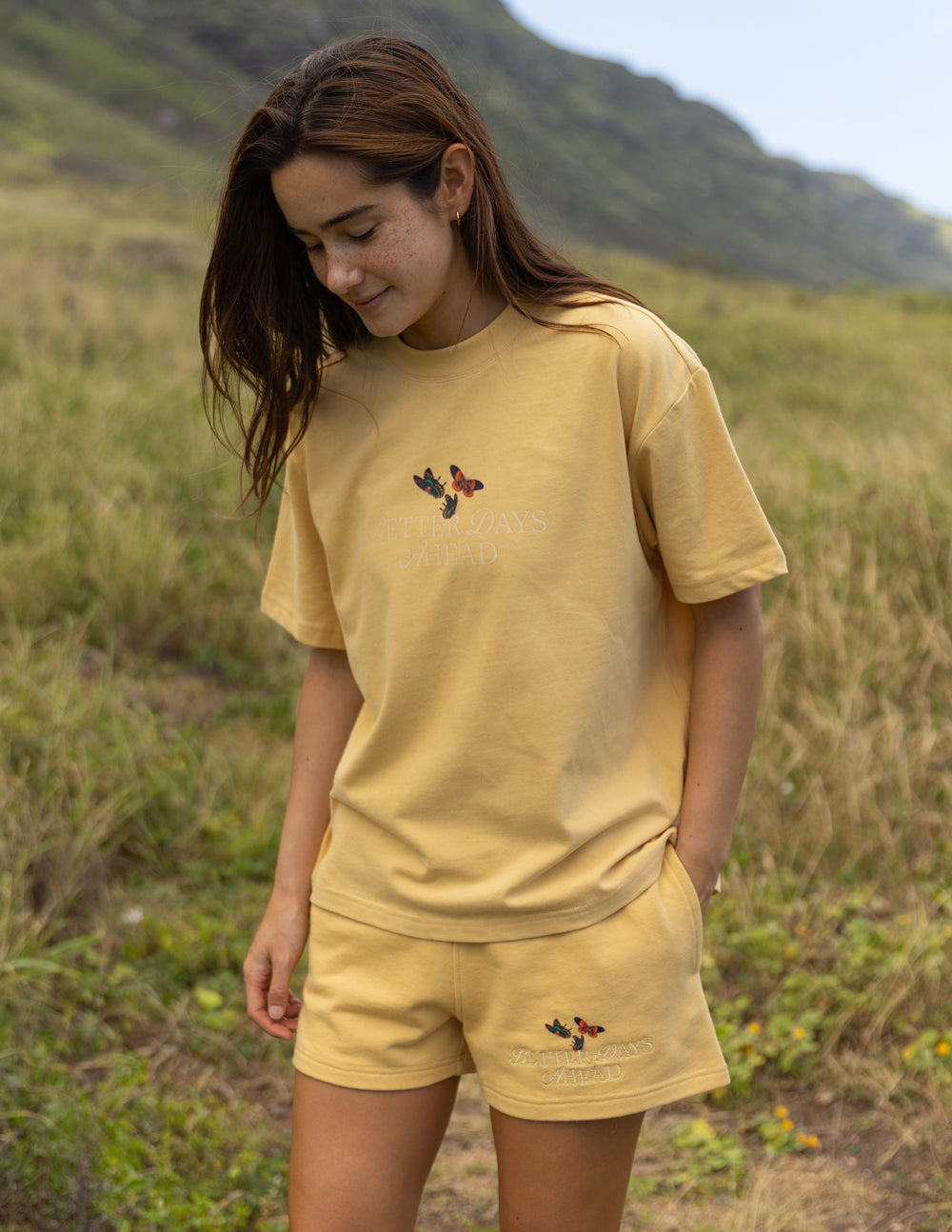 Yellow unisex T-shirt with butterfly graphic on chest, crew neck, short sleeves