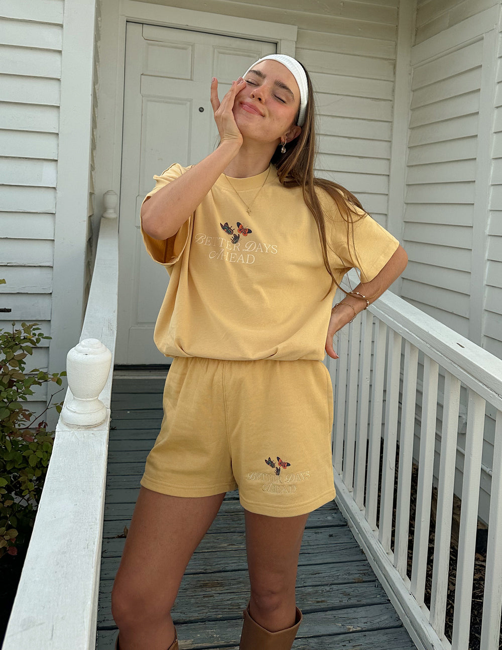 Yellow unisex T-shirt with butterfly graphic and faded text on chest, crew neck