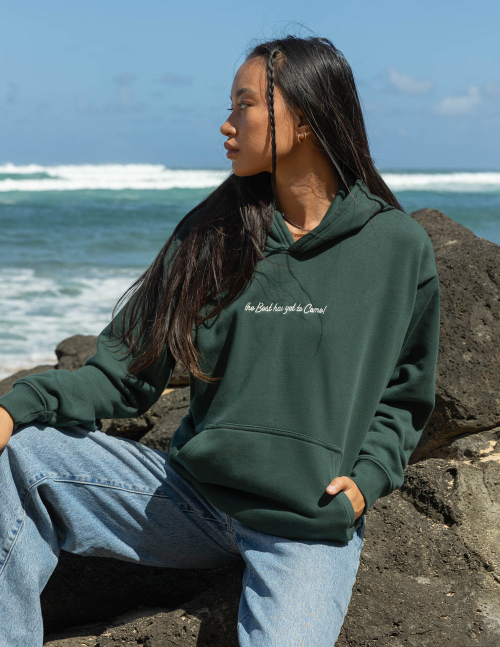 Dark green unisex hoodie with hood and small chest logo; kangaroo pocket
