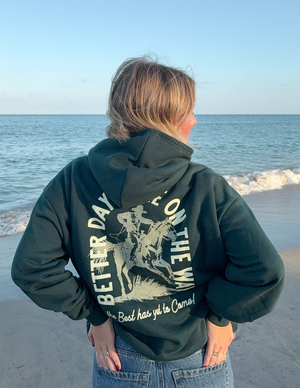 Dark green unisex hoodie with large back graphic print and hood; kangaroo pocket