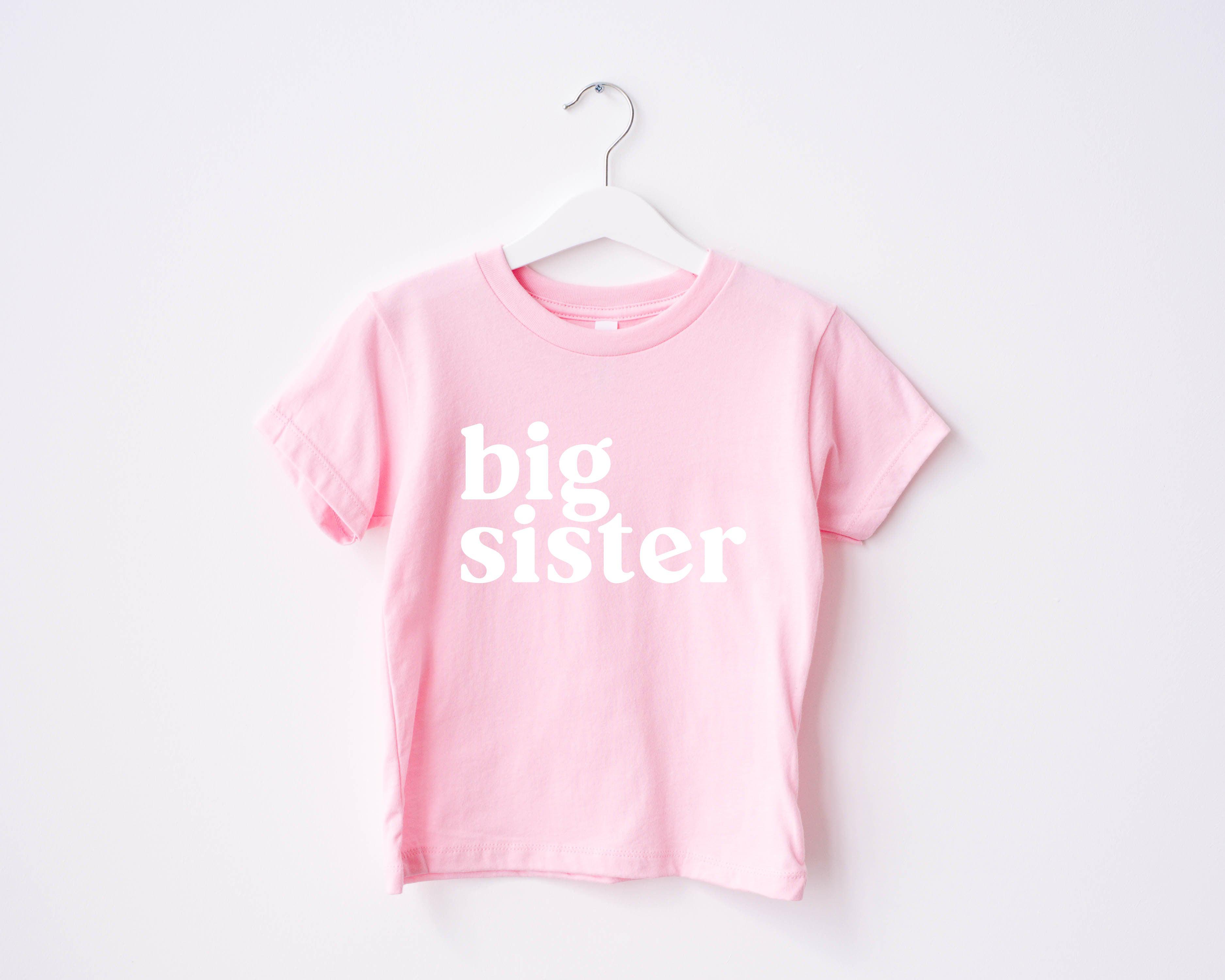 Pink baby T-shirt with 'big sister' serif print
