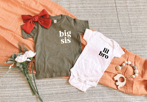 Olive toddler T-shirt with "big sis" lettering and a white "lil bro" onesie