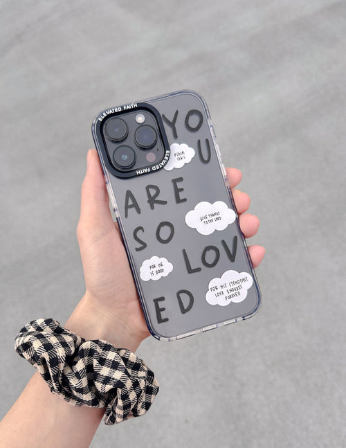 Clear phone case with black trim and “YOU ARE SO LOVED” text, cloud-shaped callouts