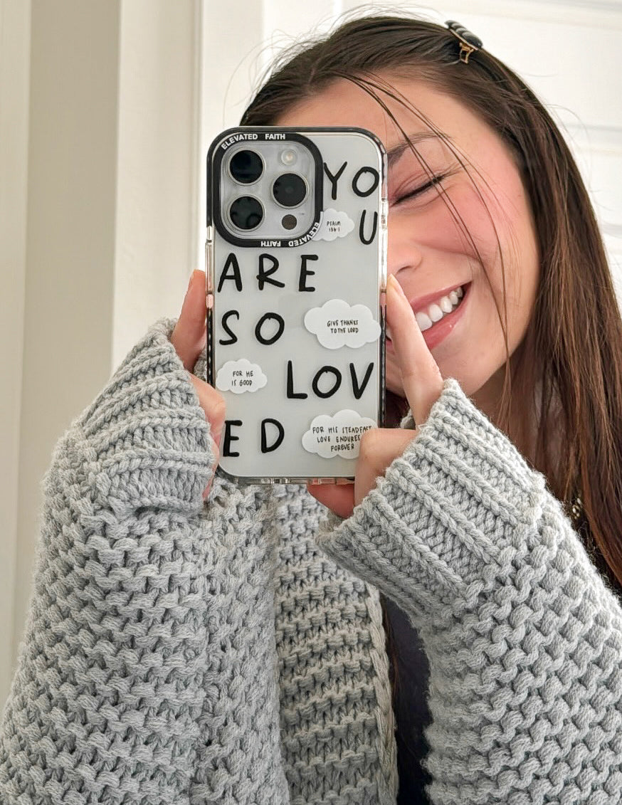 Clear phone case with black border showing “YOU ARE SO LOVED” words and cloud notes
