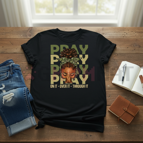 Black crewneck T-shirt with “PRAY” graphic and face illustration, text “ON IT - OVER IT - THROUGH IT”