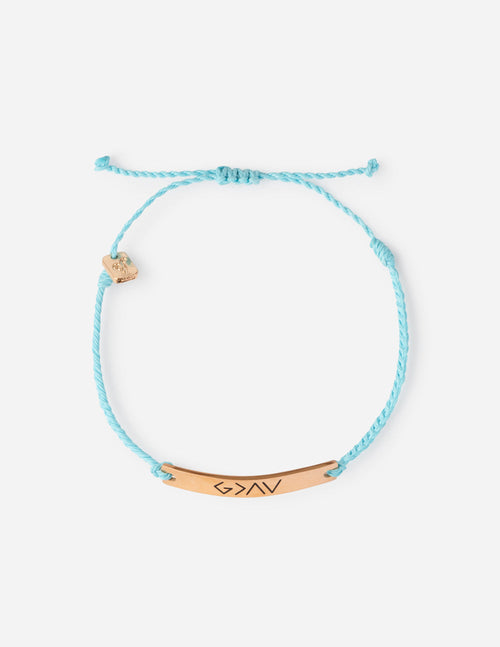 Turquoise braided string bracelet with small shell and bead charms, gold-tone bar