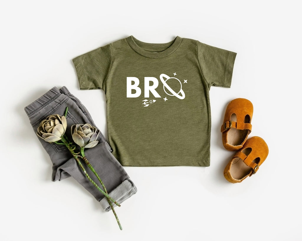 Baby and kids space-themed T-shirt, olive green with white “BRO” logo graphic on front.