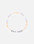 Letter bracelet with purple and peach beads and gold accents, spelling “BUT GOD”.