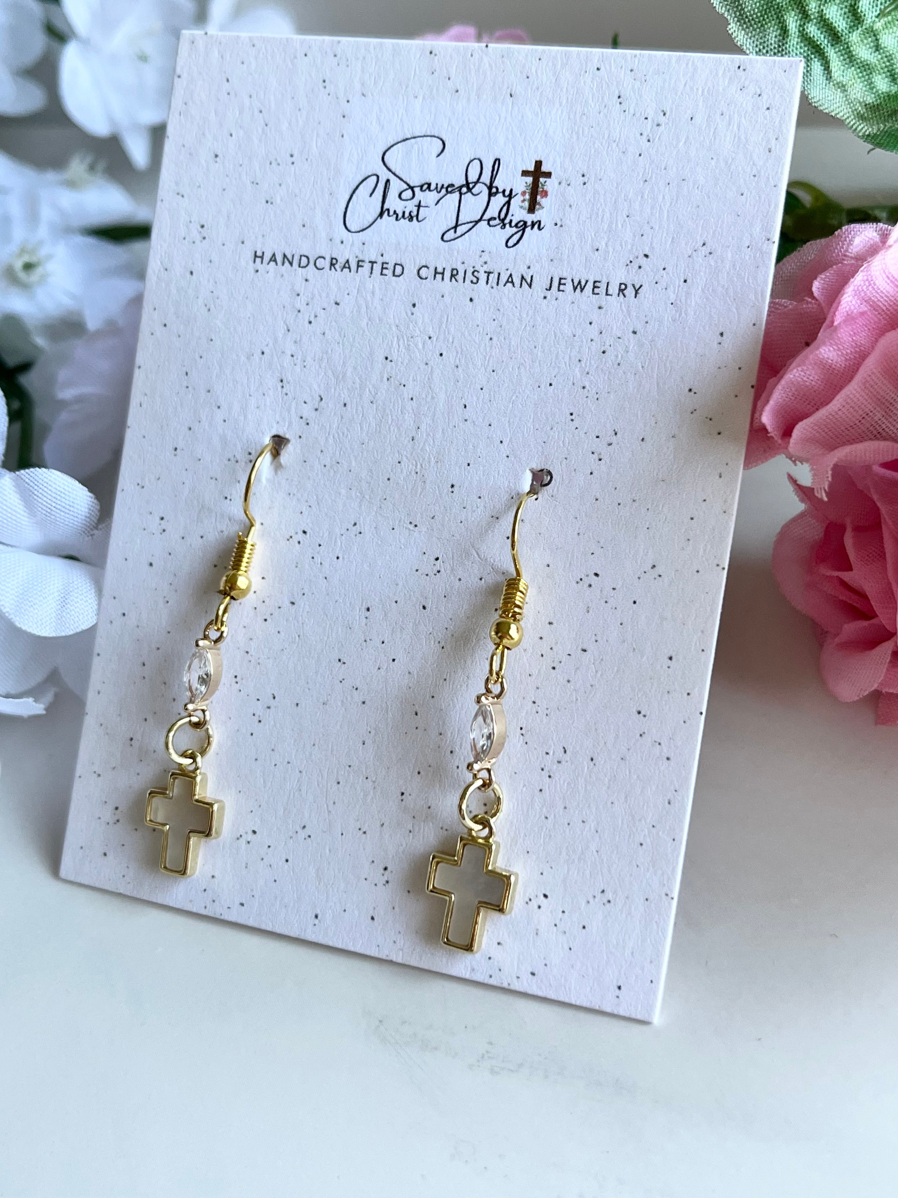 Gold-tone cross drop earrings with bead links and dangling cross charms.