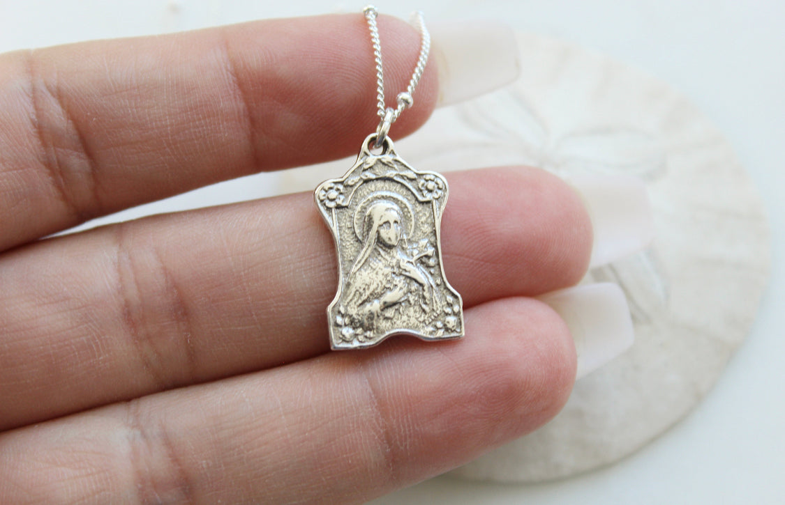 St. Therese of Lisieux 925 sterling silver necklace, saint pendant held in hand