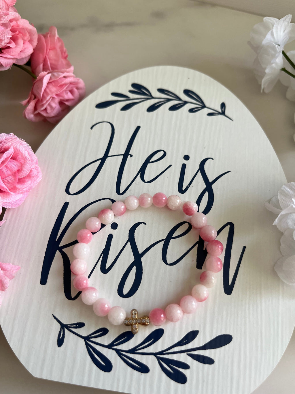 Pink beaded cross bracelet with small gold cross charm